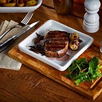 Steak served on a square plate