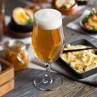 Draft Stemmed Beer Glasses with beer and food