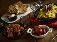 Black Enamel Bowls with food displayed.